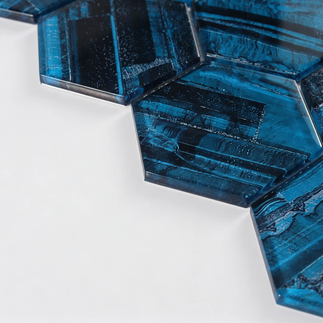 Glossy teal hexagon glass tile corner with black linear texture and clear edge