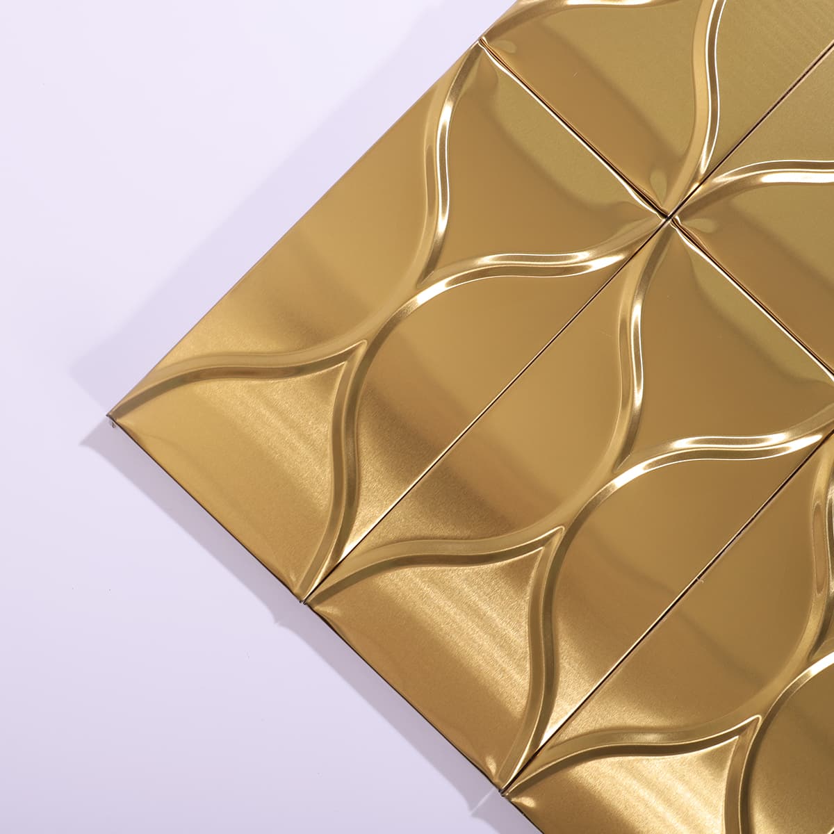 Angled corner view of gold wave pattern tile