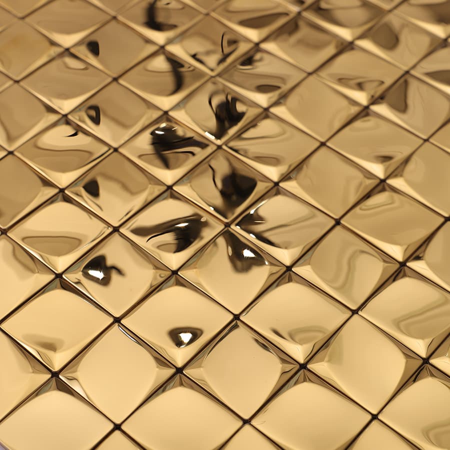 Close-up of gold 3D mini square tile reflecting light