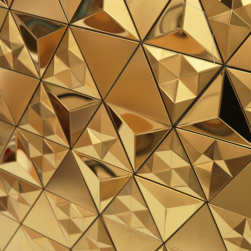 Close-up of gold 3D pyramid stainless steel tiles showing reflective geometric facets