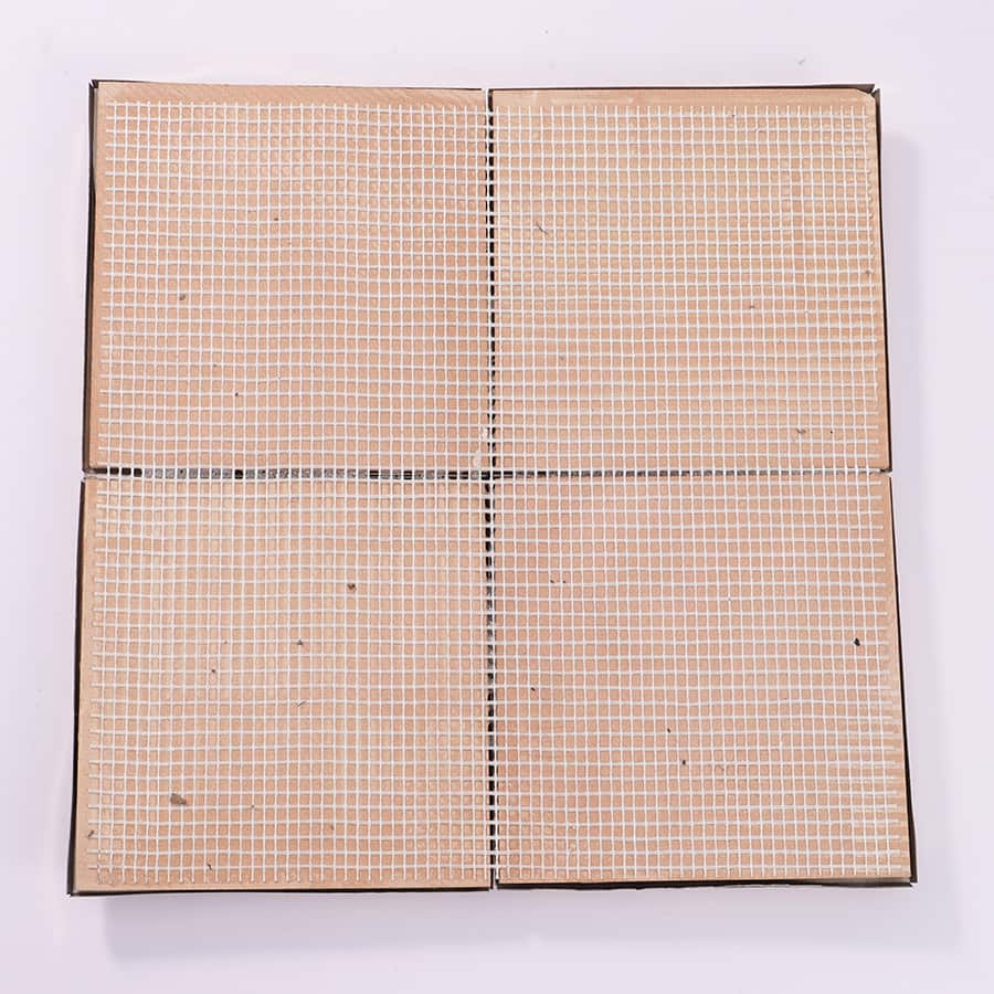 Back view of gold 3D square tile with mesh