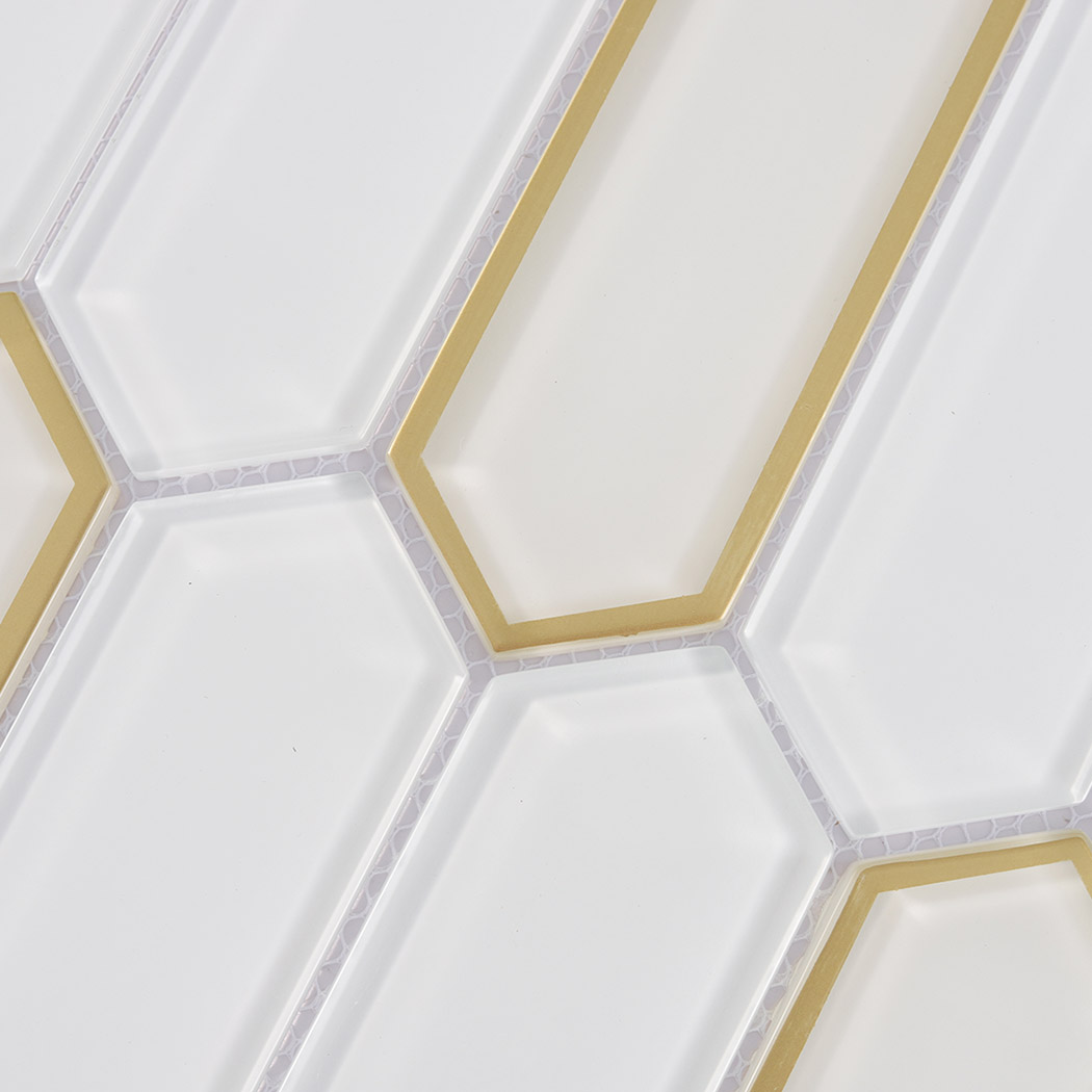 Macro detail of white picket glass tiles with electroplated gold glass borders