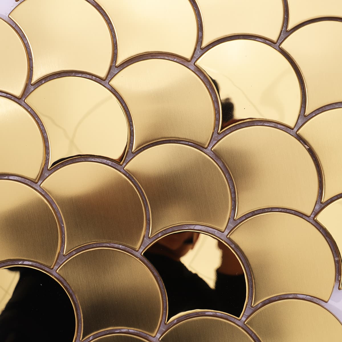 Close-up of mixed finish gold fish scale mosaic surface