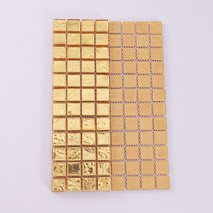 Front and back view of gold glass mosaic tile showing mesh backing.