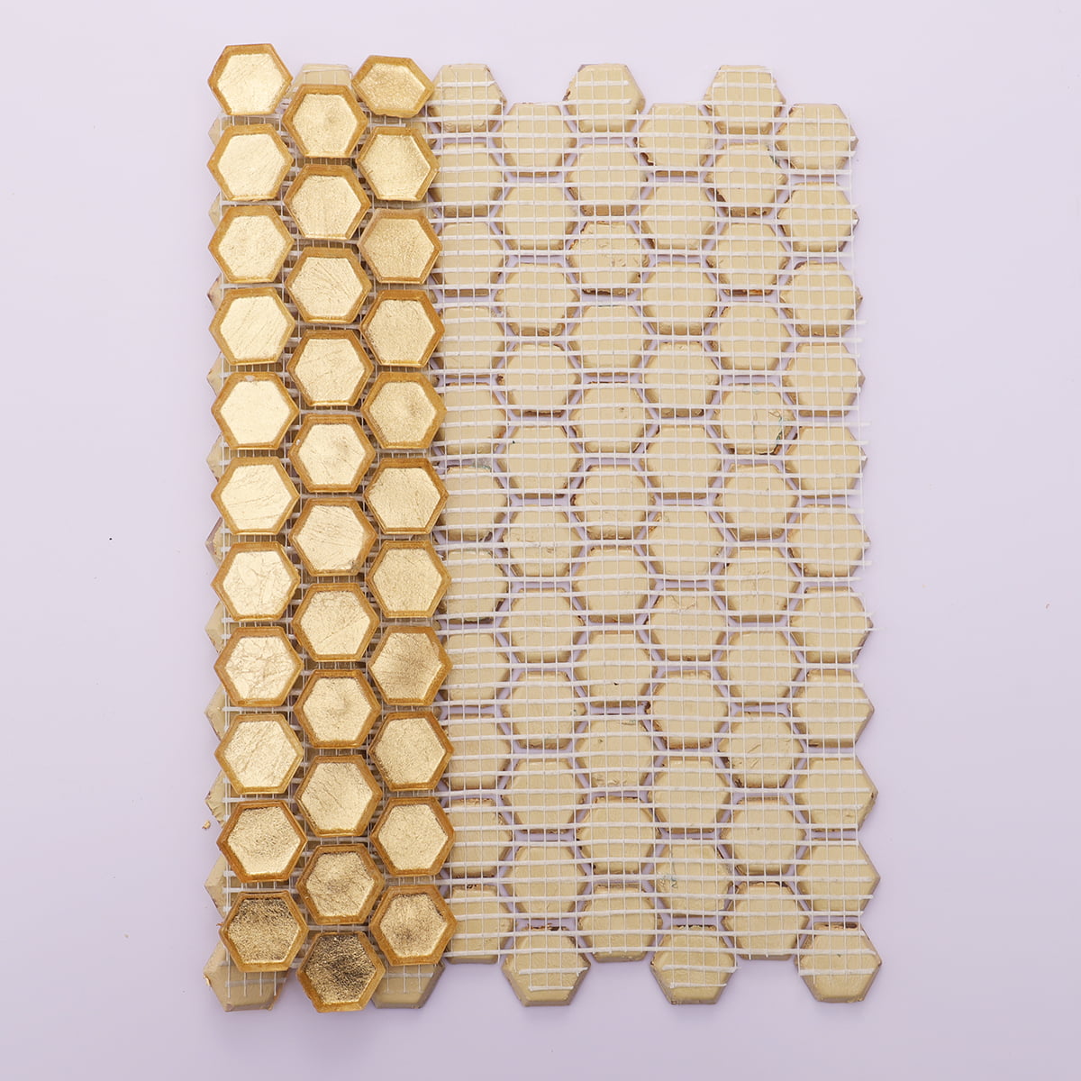 Back view of gold hexagon mosaic tiles with mesh backing for installation