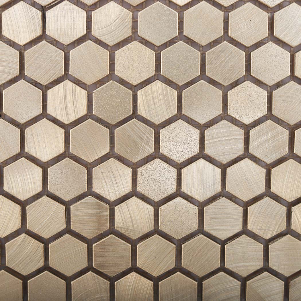 Surface detail of brushed gold mini hexagon aluminum mosaic tile