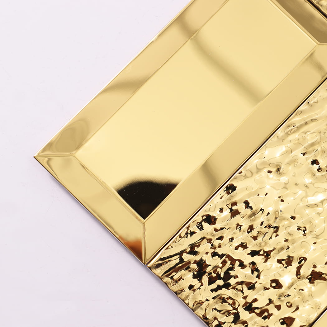 Close up of gold mosaic tile corner showing texture and reflection.