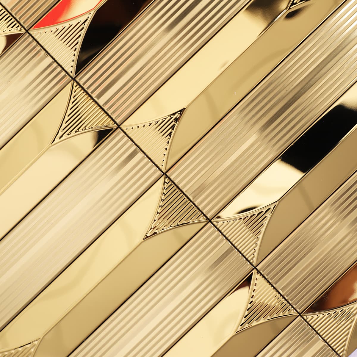 Detailed texture of gold brushed stainless mosaic with groove pattern