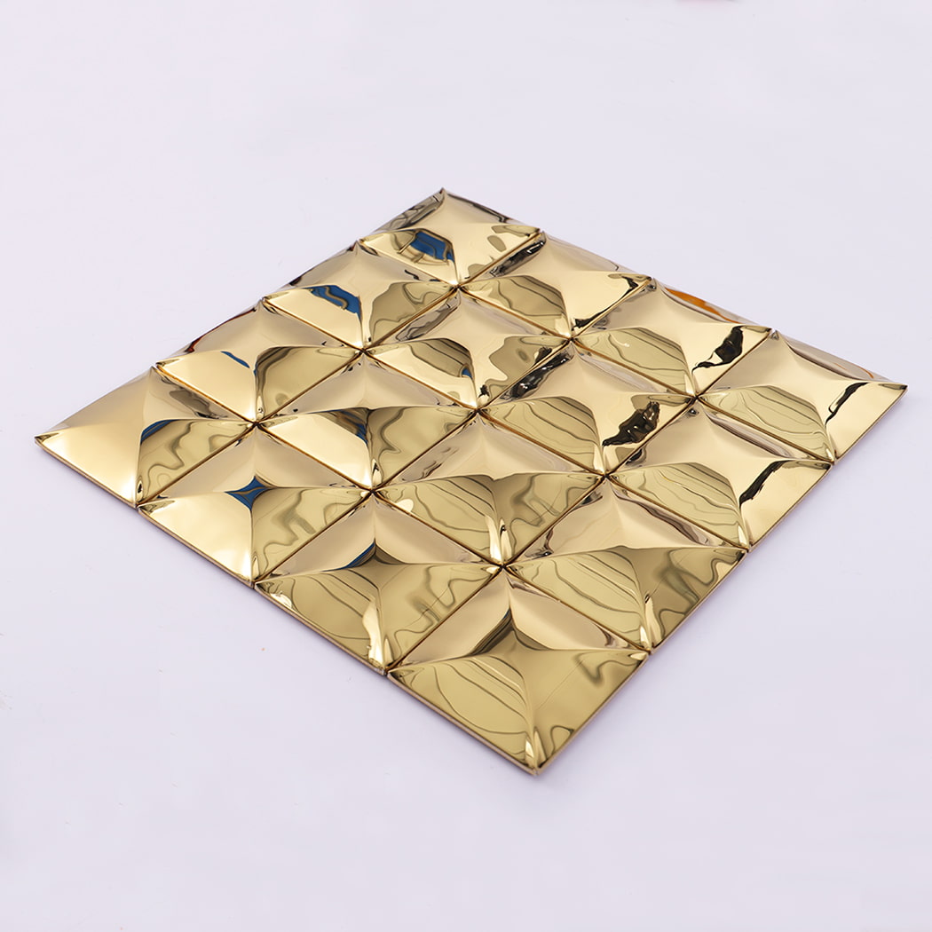 Layout view of gold stainless steel 3D square wall tiles arranged on flat surface.