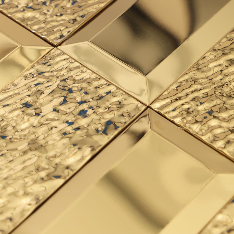 Corner detail of gold textured and beveled wall tiles