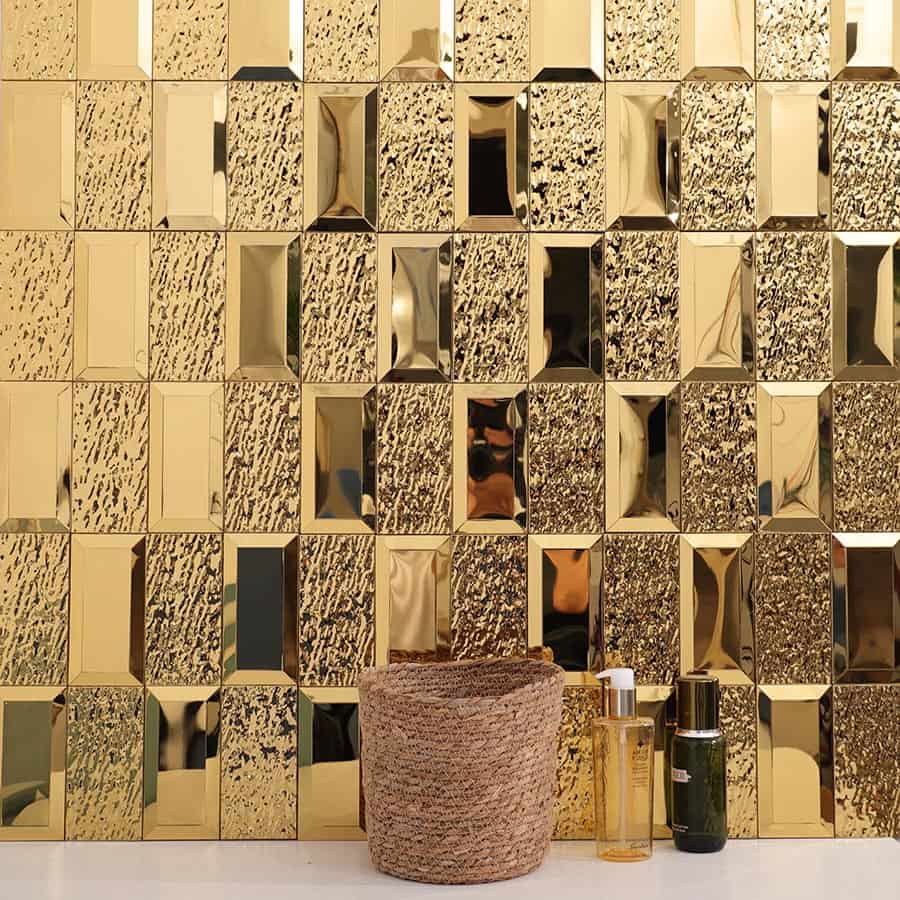 Gold textured beveled wall tiles with decorative items