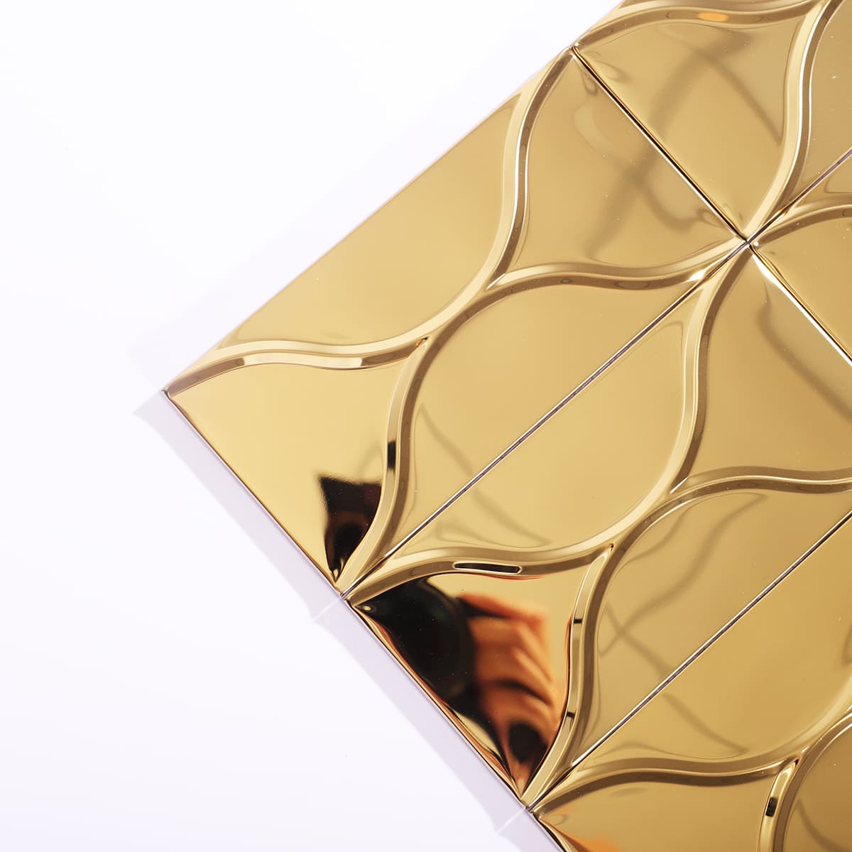 Gold curved wave tile with reflective surface from corner angle