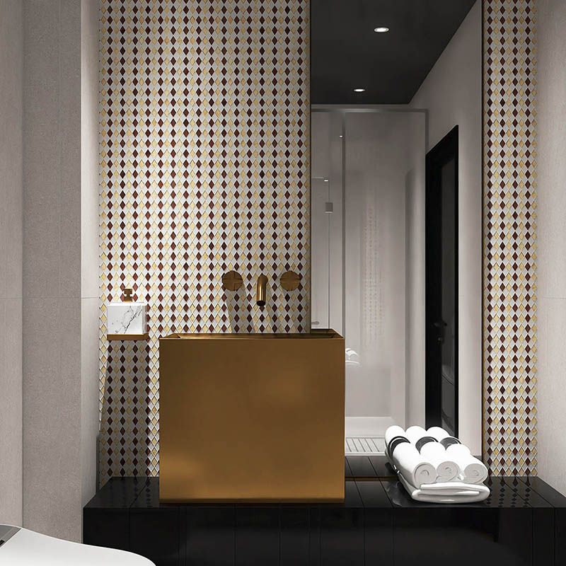 Gold and white mosaic bathroom sink wall