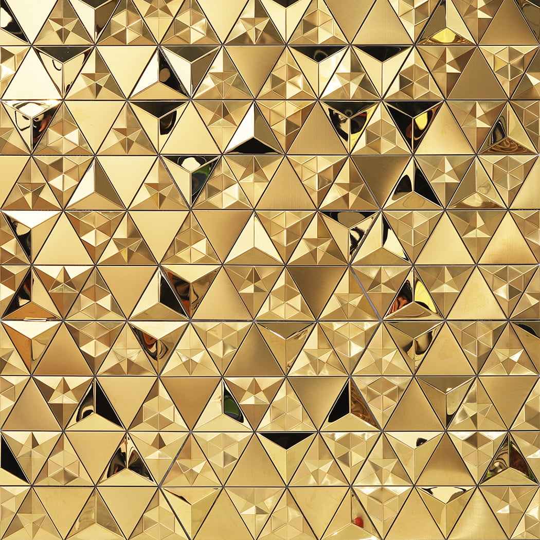 A full-frame pattern of interlocking gold 3D triangles with various textures.