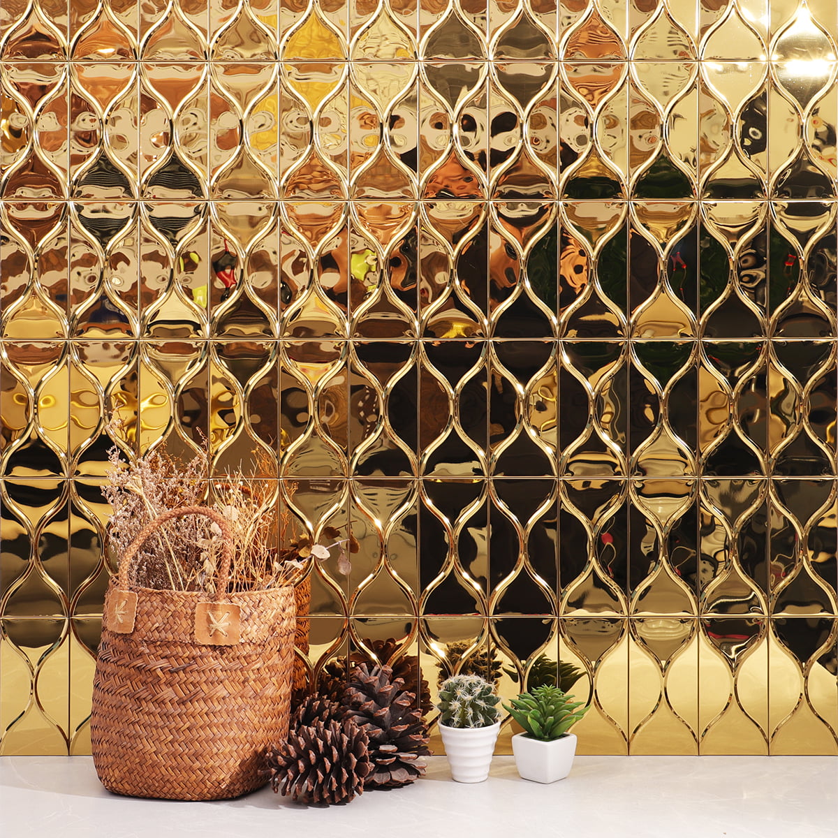 Golden tiles with a unique curved pattern, decorated with plants in the foreground