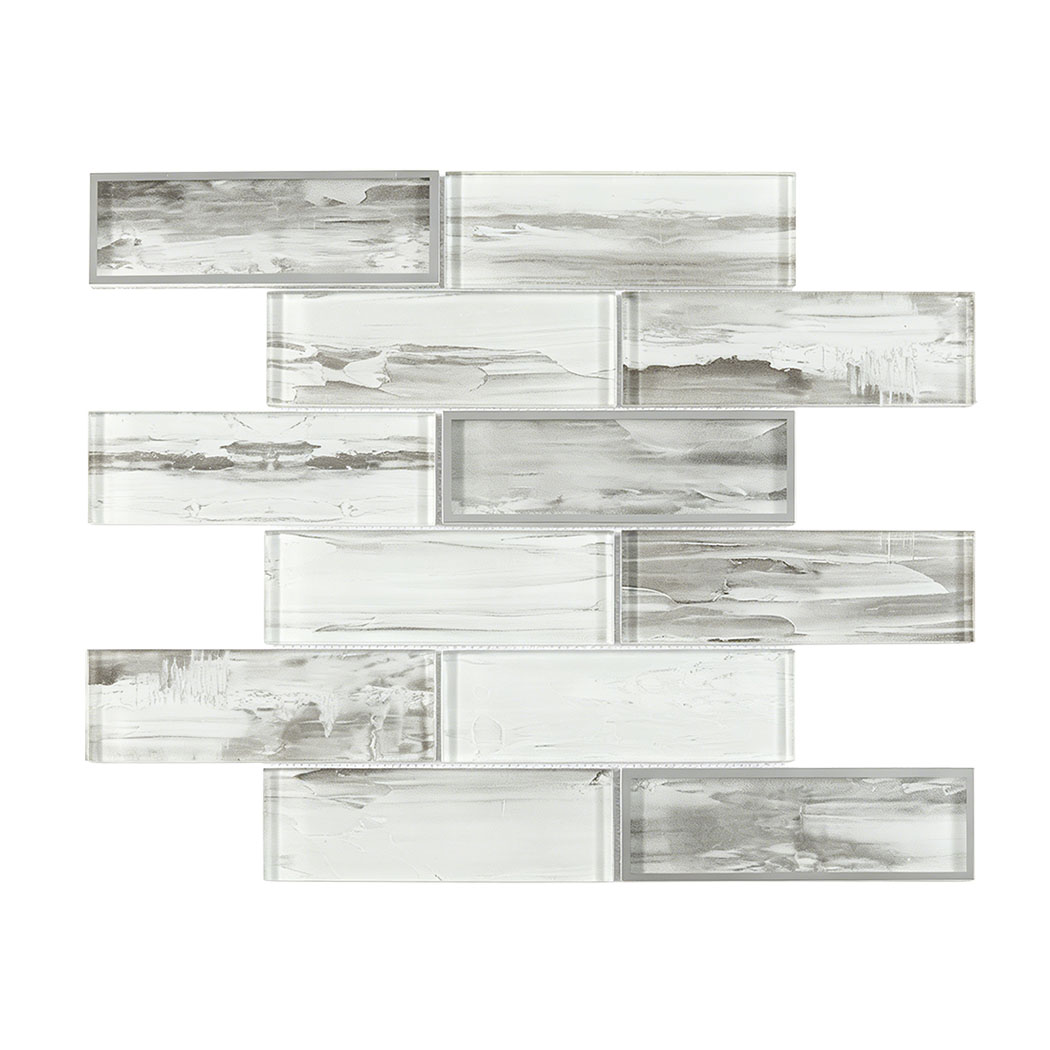 A mesh backed sheet of interlocking gray and white linear glass mosaic subway tiles.