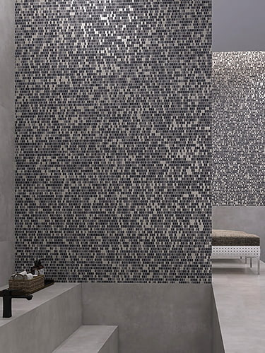 Modern gray glass oval mosaic tiles create a textured spa feature wall
