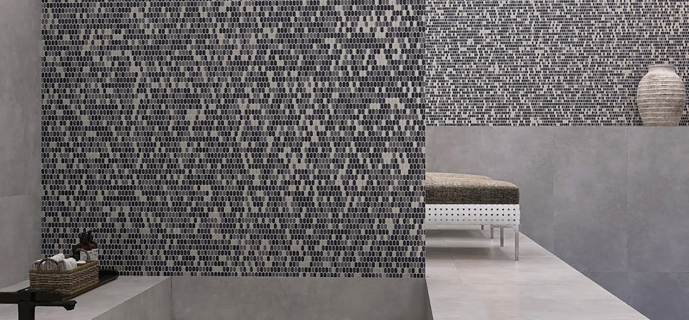 Gray spa wall with small oval glass mosaics in abstract pattern