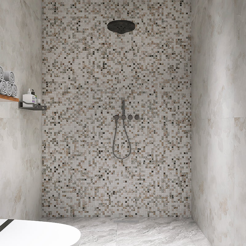 Square mosaic tiles in gray and white tones used on a contemporary shower wall.