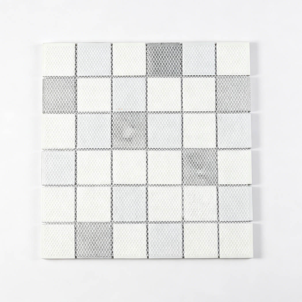 Mesh back of gray and white square mosaic sheet showing tile layout