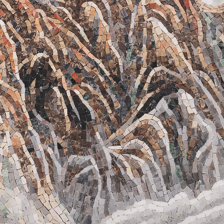 Close-up of swirling ridges in a Great Wall mosaic mural showing textured stone tesserae.