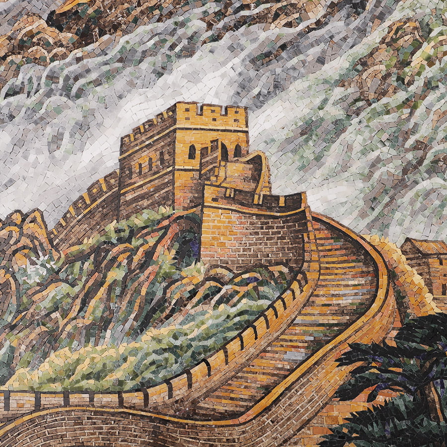 Mosaic tile detail showing a watchtower with a blooming tree beside a winding wall.