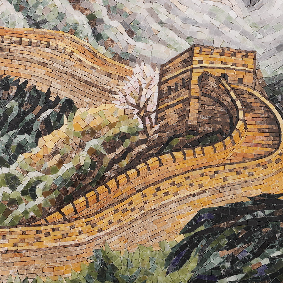 Mosaic tile detail showing a watchtower with a blooming tree beside a winding wall.