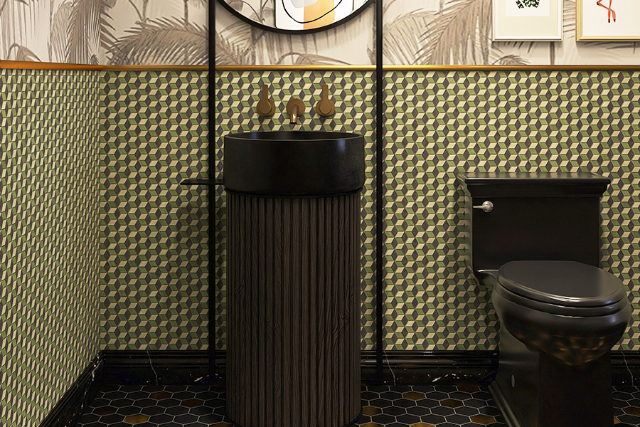 Close-up of 3D cube glass mosaic tiles behind a black pedestal sink with elegant gold trim.