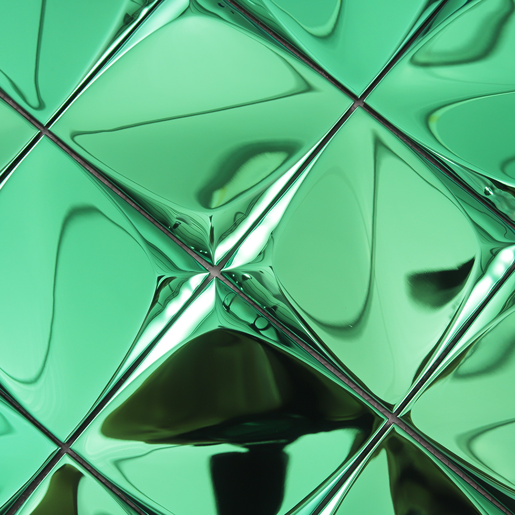 Close up view highlighting the texture and intersection point of four green 3D metal tiles.