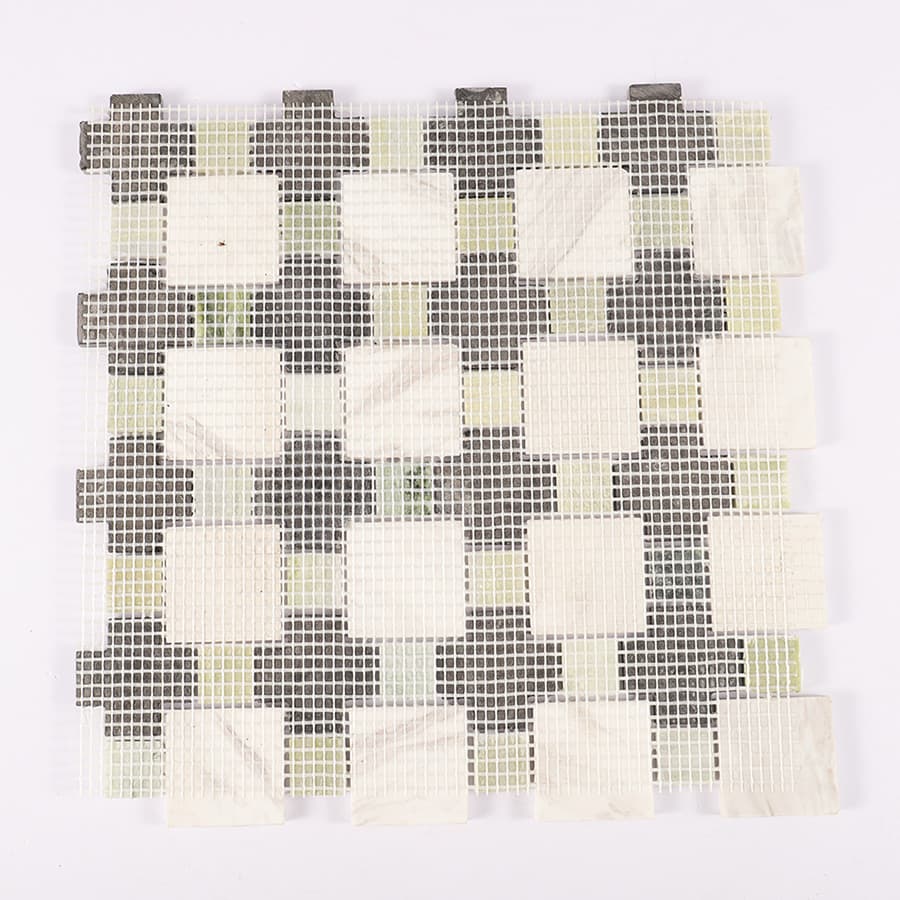 Back view of green black and white marble mosaic tile with mesh backing.
