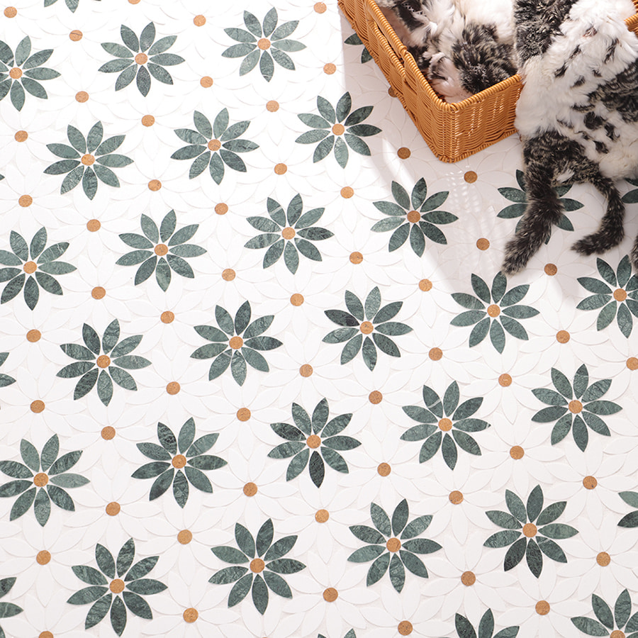 White floor tiles with green floral geometric patterns and brown dot centers