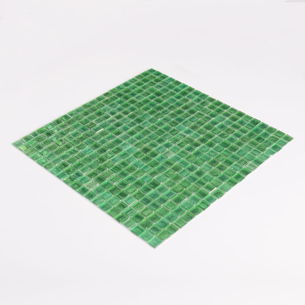 full sheet of green glass mosaic tiles photographed at low angle