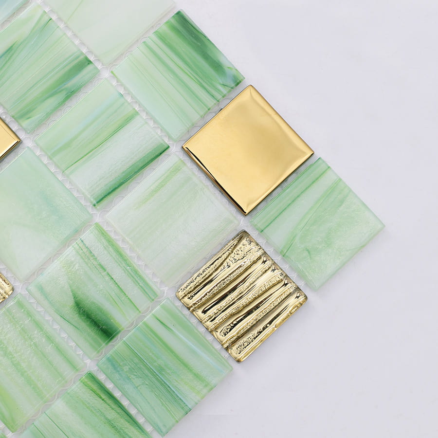 Close up of green mosaic tile corner with gold metallic square