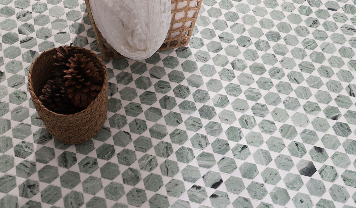 Green marble hexagon floor tiles with white triangles and woven baskets in a wide view