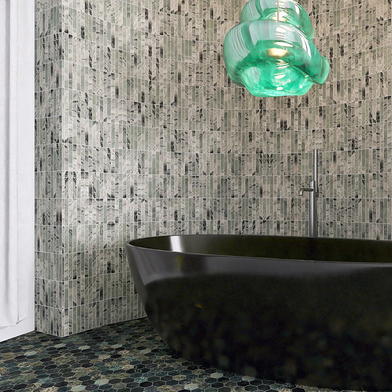 Stylish bathroom with green marble tiles on the wall and hexagonal floor tiles