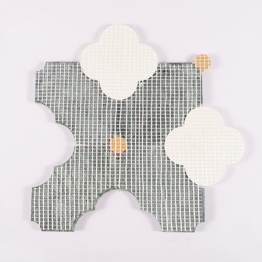 Back view of green marble clover tile with mesh backing for installation.