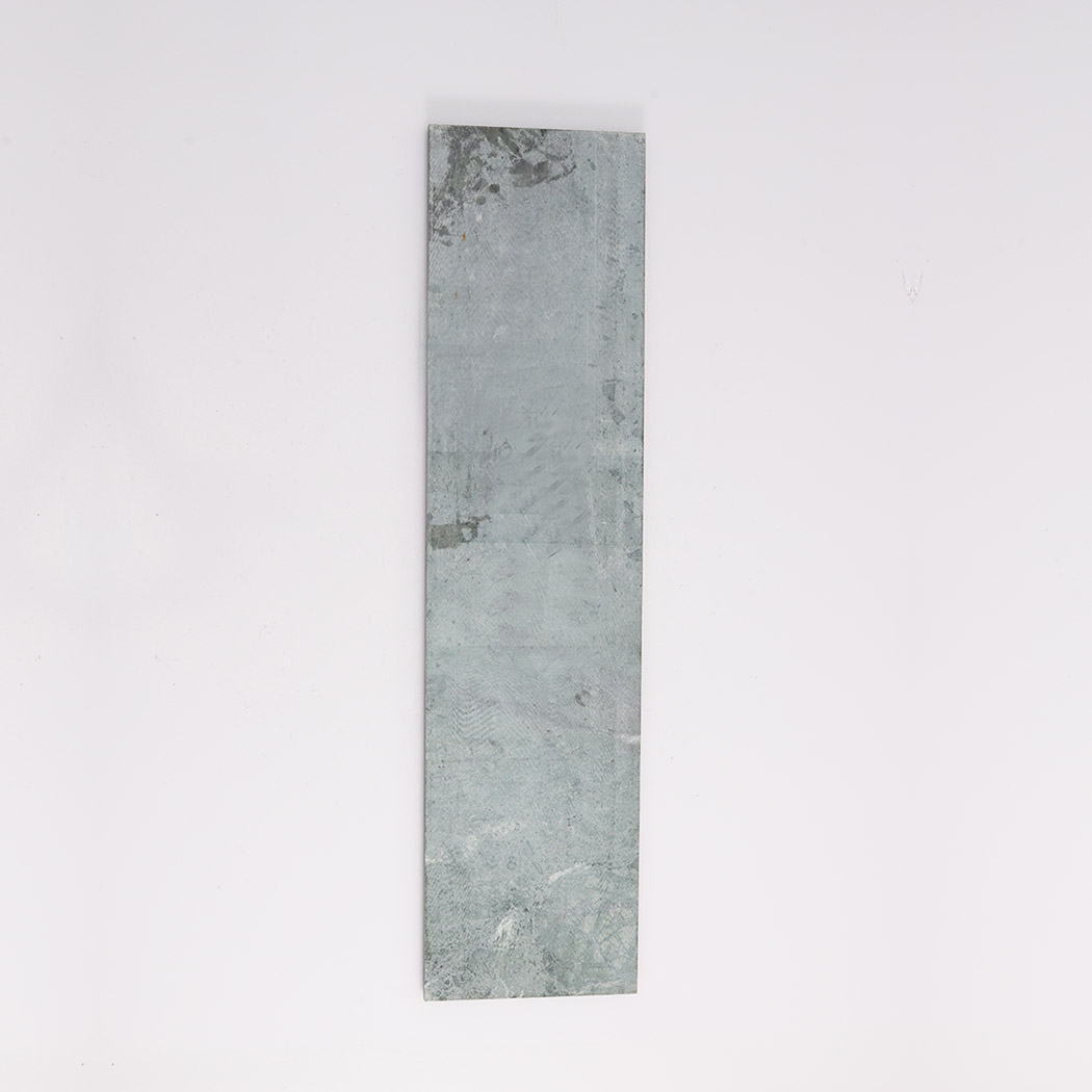 Back view of green marble fluted tile with flat natural stone surface