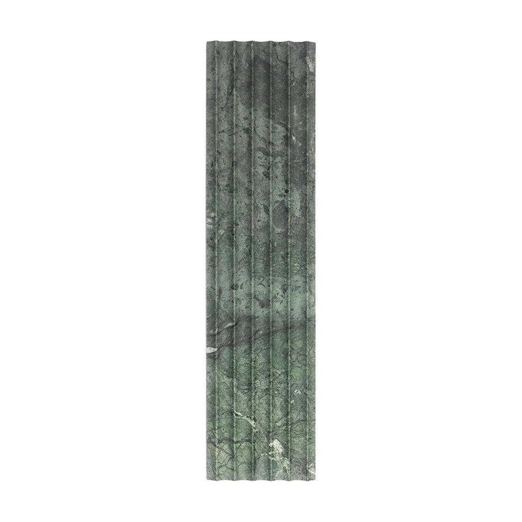 Front view of green marble fluted tile with dark natural veining