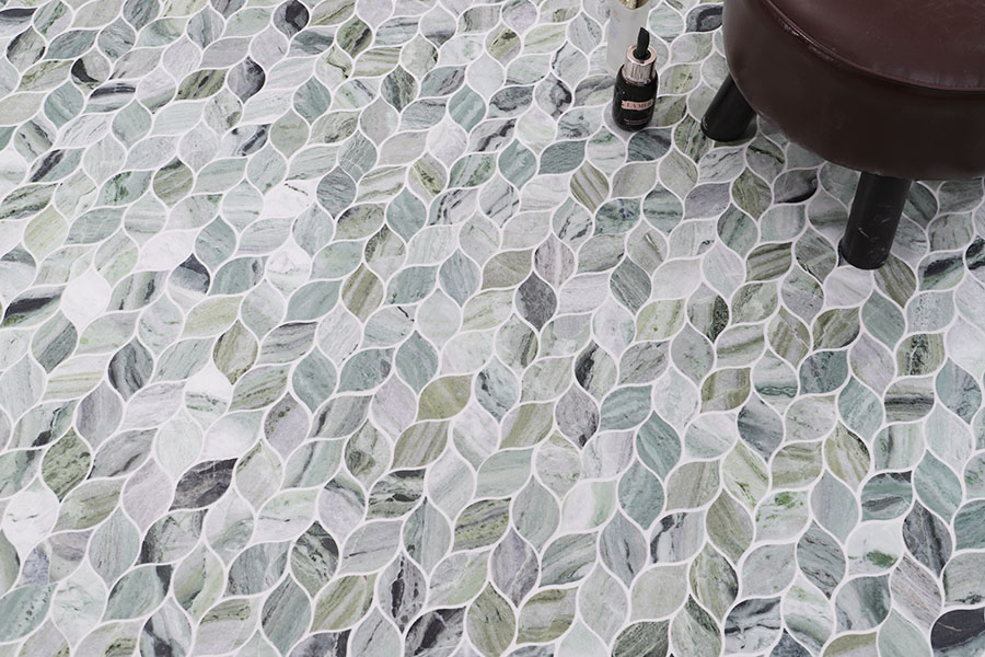 Green and white marble leaf mosaic floor tile with natural stone veining