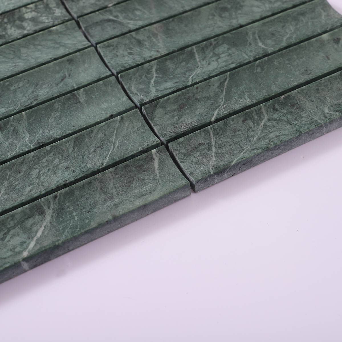 Edge angle close-up of green marble mosaic sticks