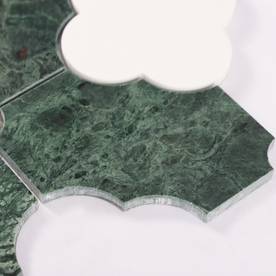 Edge view of green marble tile showing shape and layered thickness.