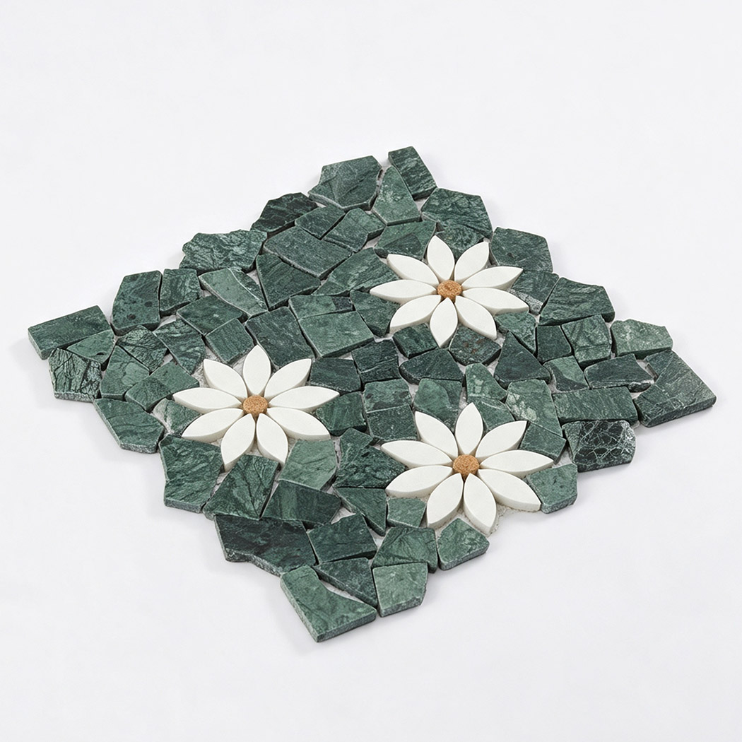 Angled view of green irregular marble mosaic tile with three white floral patterns