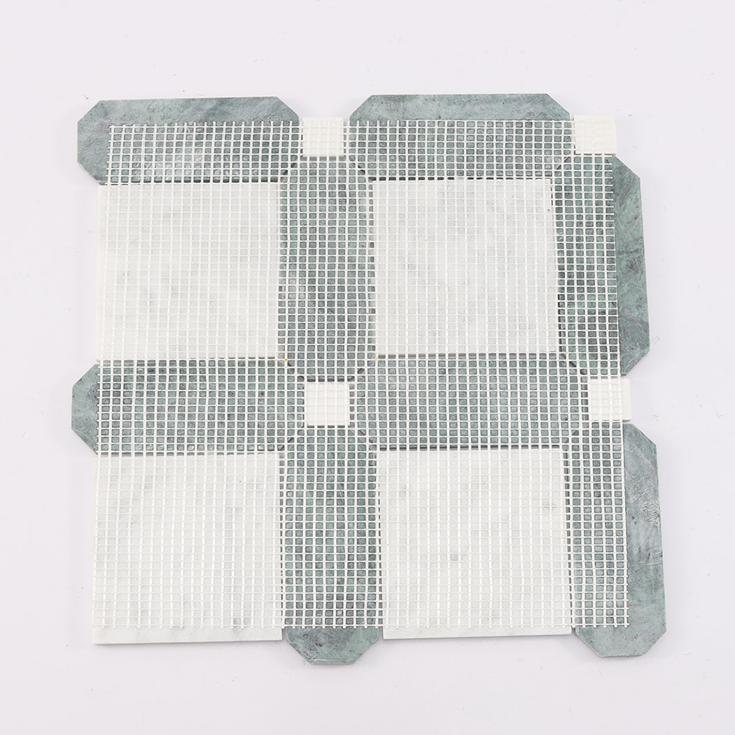 Back view of green and white framed square marble mosaic tile with mesh backing