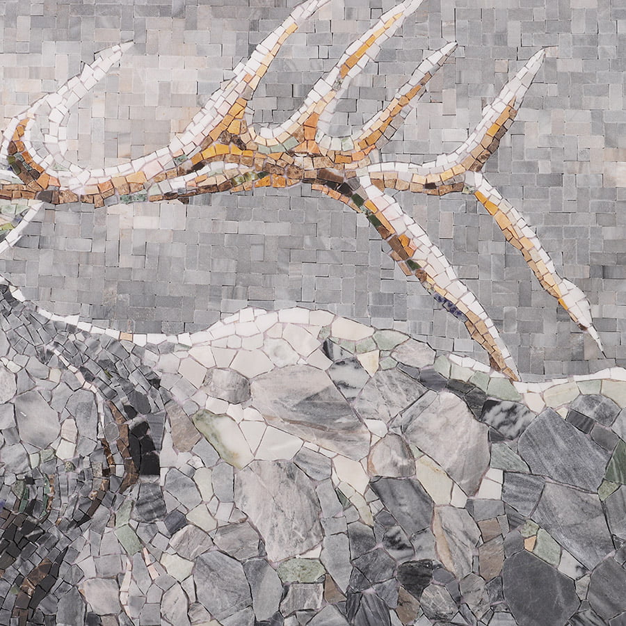Close-up of the grey marble mosaic showing intricate tile details of the stag’s horns and fur.