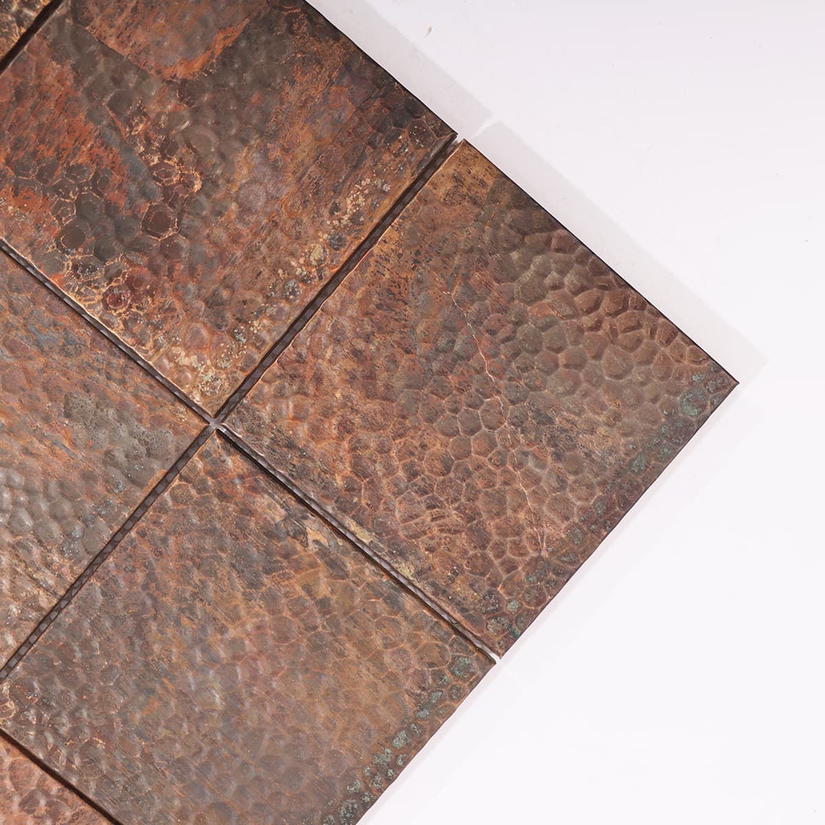 Hand-hammered copper mosaic showing rustic texture