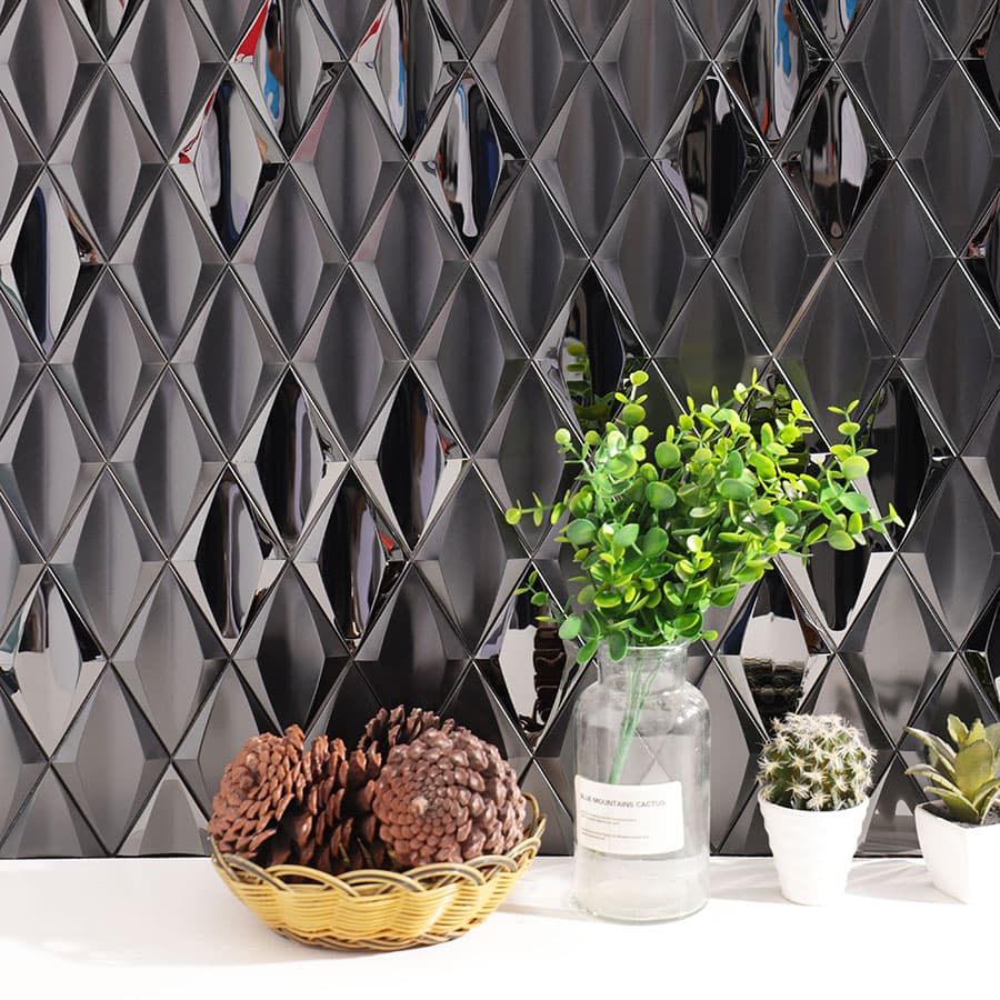 Interior wall with black stainless steel diamond mosaic tiles and plants