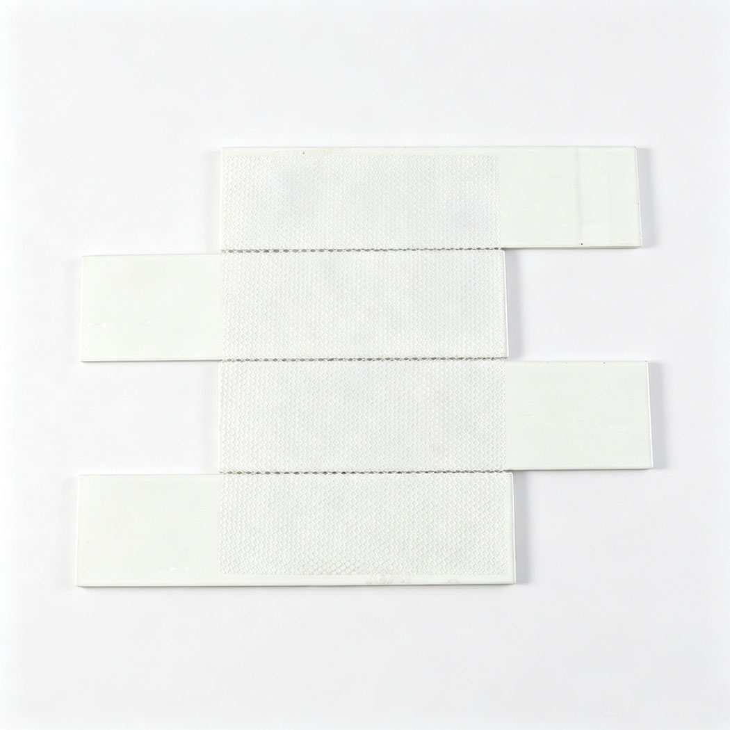 Back view of a grey glass mosaic tile sheet highlighting the interlocking white mesh.