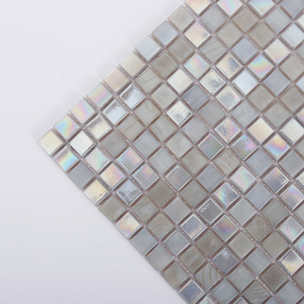 Corner detail of iridescent dark grey glass square mosaic tile
