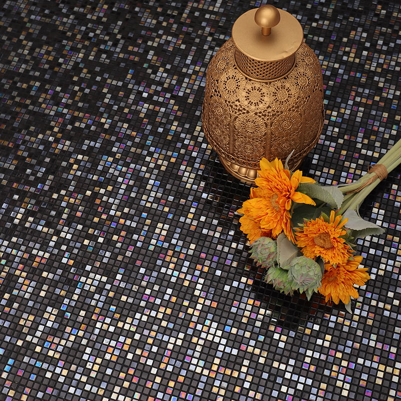 Close-up of iridescent glass tiles, reflecting rich, shimmering colors.