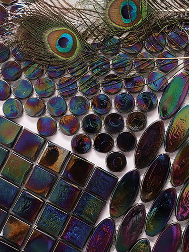 Iridescent glass tiles featuring peacock feather colors in vibrant shades.